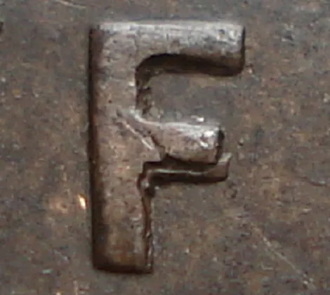 Re-engraved F in NEWF