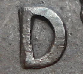 Re-engraved D in LAND