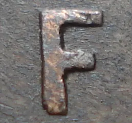 Re-engraved F in NEWF