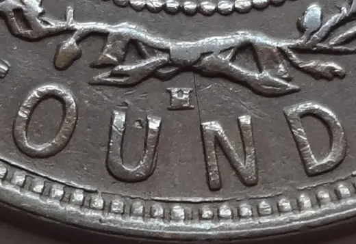 Re-engraved E in OUND