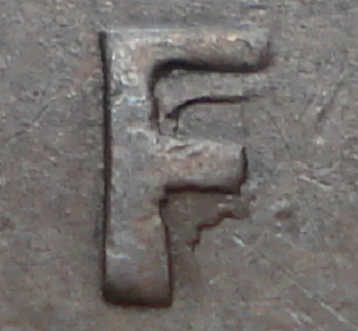 Re-engraved F in NEWF