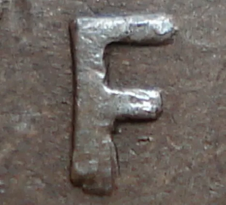 Re-engraved F in NEWF