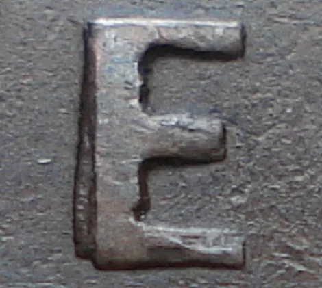 Re-engraved E in NEWF