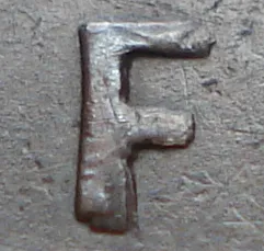 Re-engraved F in NEWF