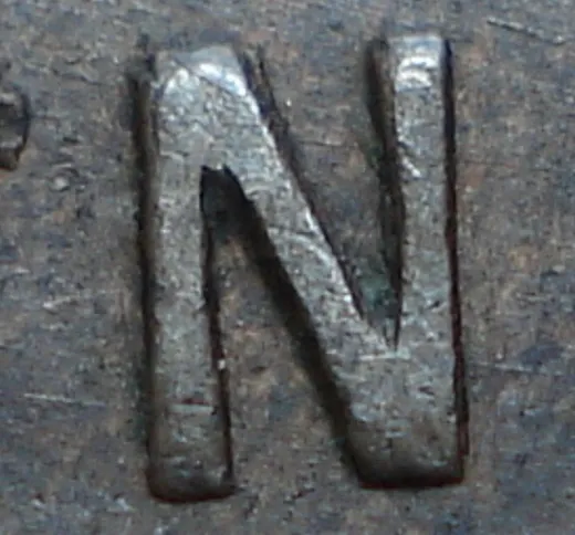 Re-engraved N in NEWF