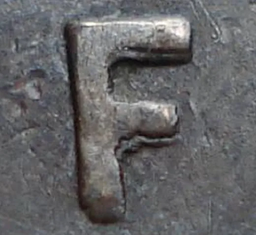 Re-engraved F in NEWF
