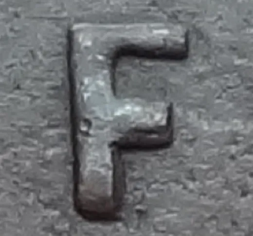 Re-engraved F in NEWF