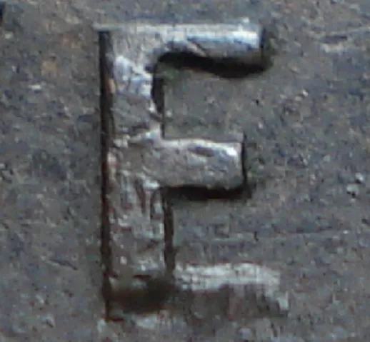 Repunched F over E in NEWF