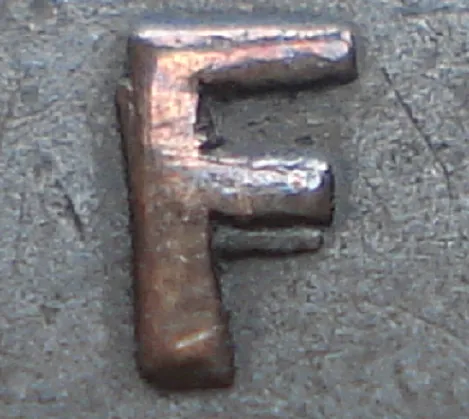 Re-engraved F in NEWF