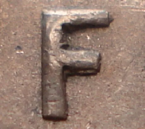 Re-engraved F in NEWF