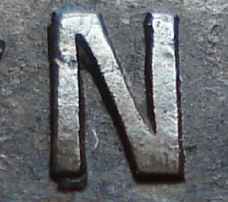 Re-engraved N in NEWF