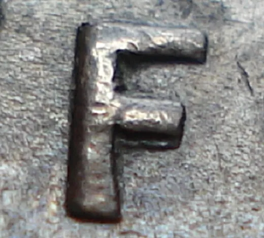 Re-engraved F in NEWF