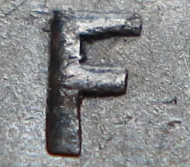 Re-engraved F in NEWF