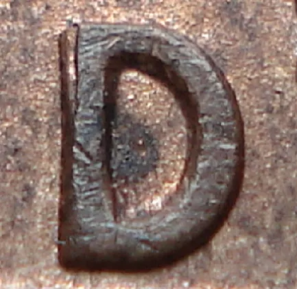 Re-engraved D in LAND