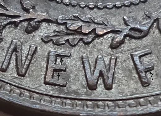 Re-engraved F in NEWF