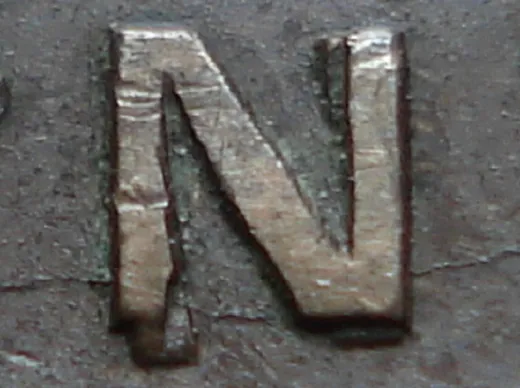 Re-engraved N in NEWF