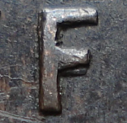 Re-engraved F in NEWF