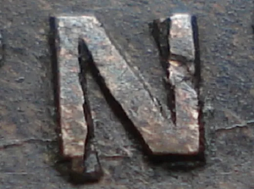 Re-engraved N in NEWF