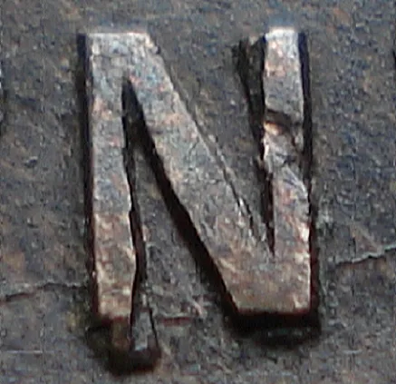 Re-engraved N in NEWF
